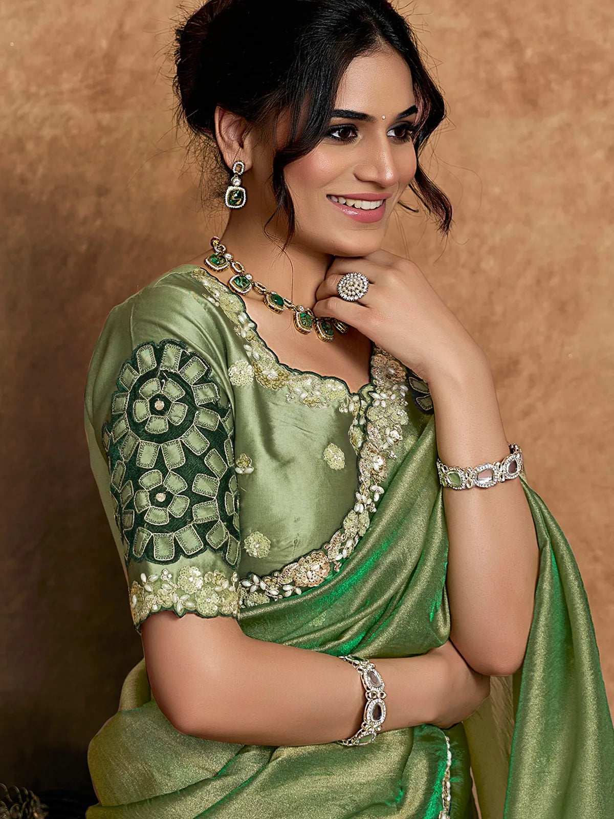 Tarani Rajashri green Zari Organza Satin saree portrait view with embellished blouse and jewellery styling