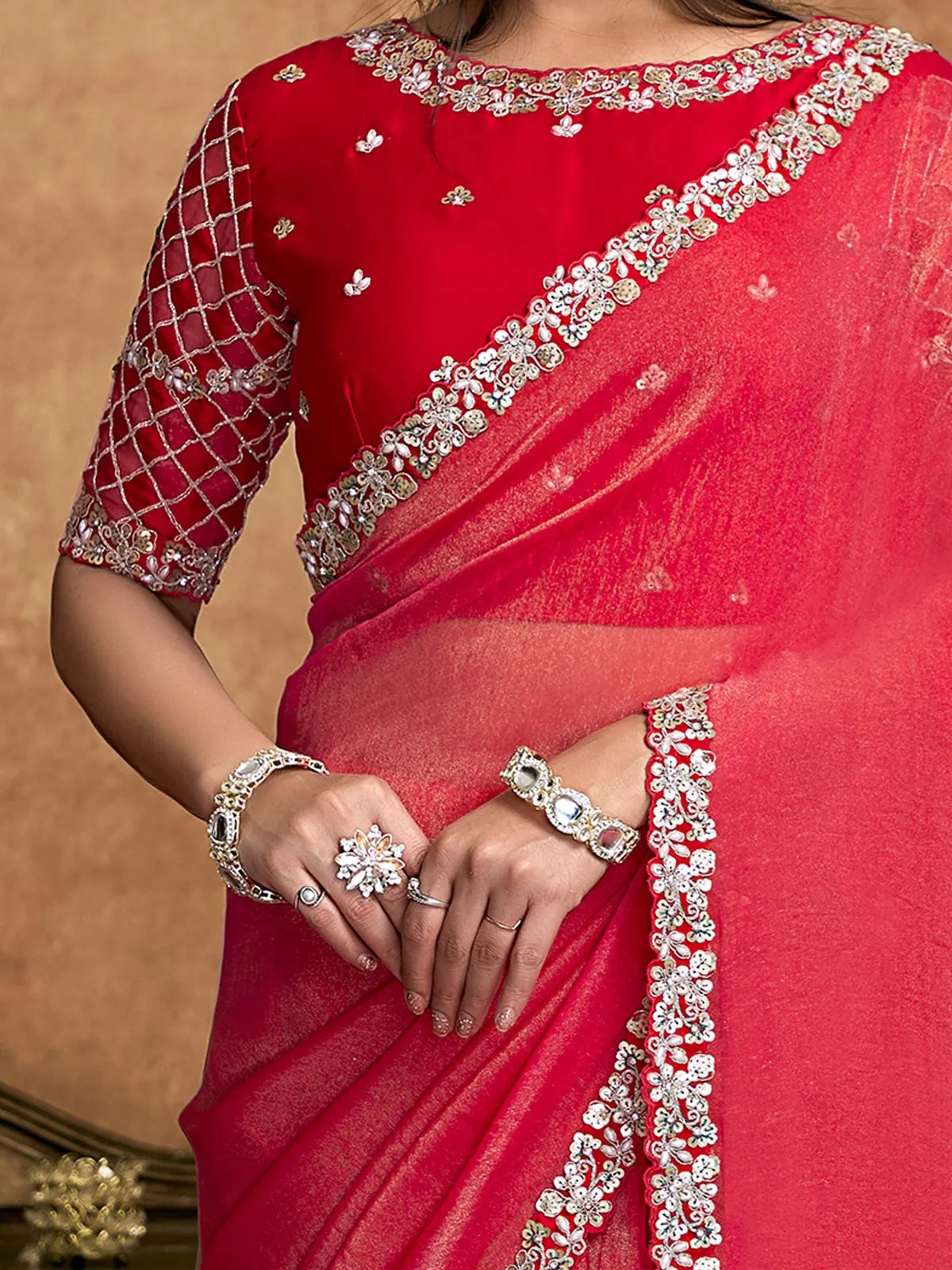 Tarani Amodini red saree closeup showing pearl sequin stone border detailing and elegant drape
