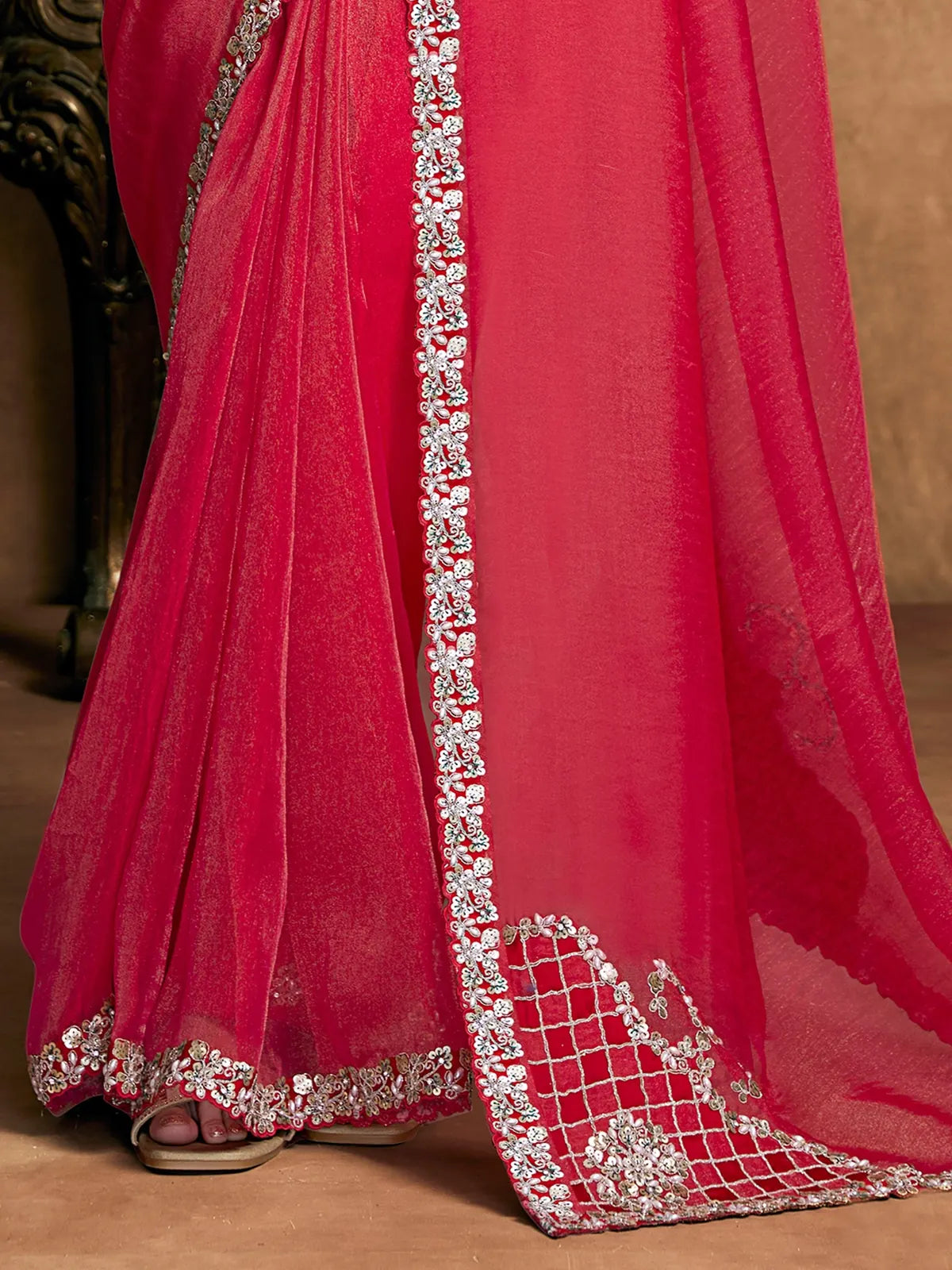 Tarani Amodini red saree pallu view with embellished floral border and shimmering finish