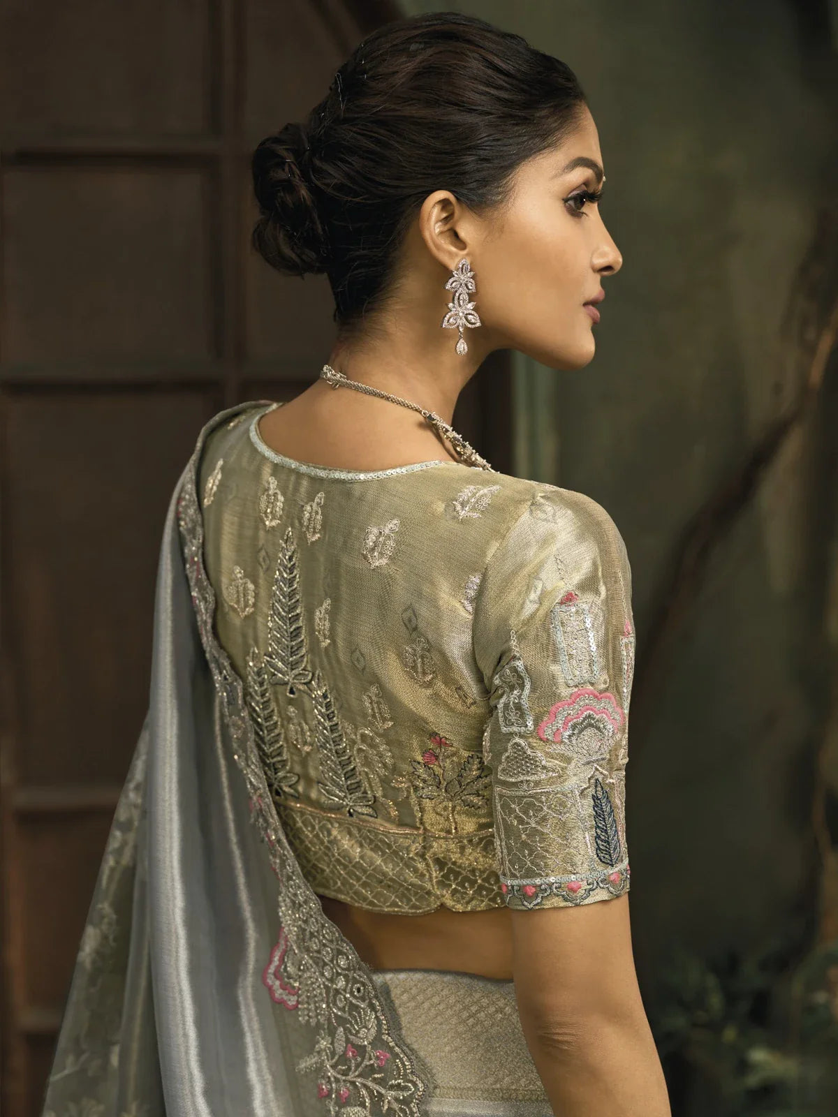 Tarani silver ziraf saree with back blouse design featuring moti and zari work